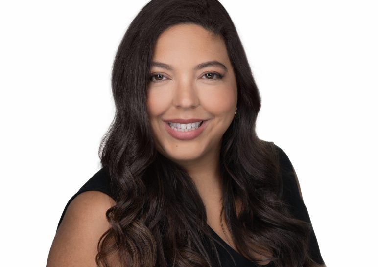 A studio portrait of a professional business headshot.