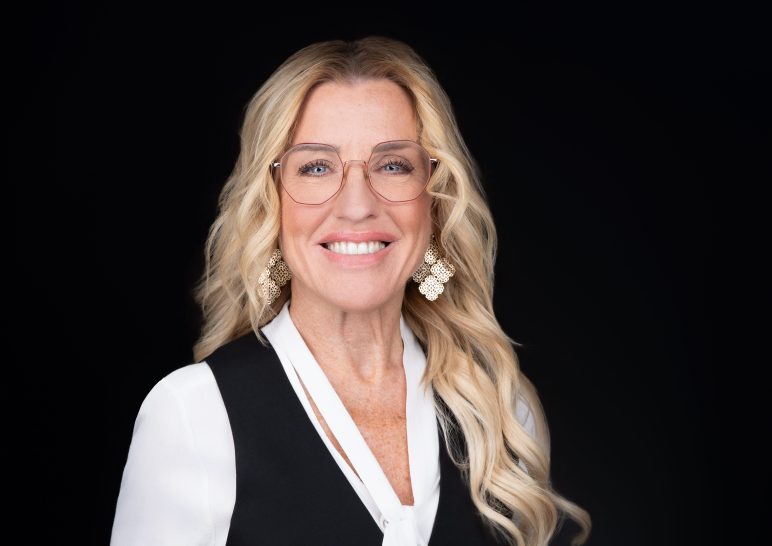 A studio portrait of a professional business headshot.