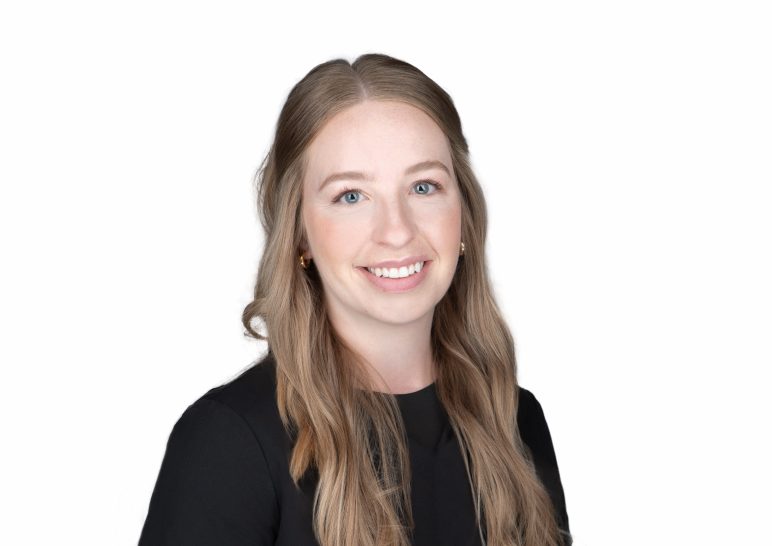 A studio portrait of a professional business headshot.