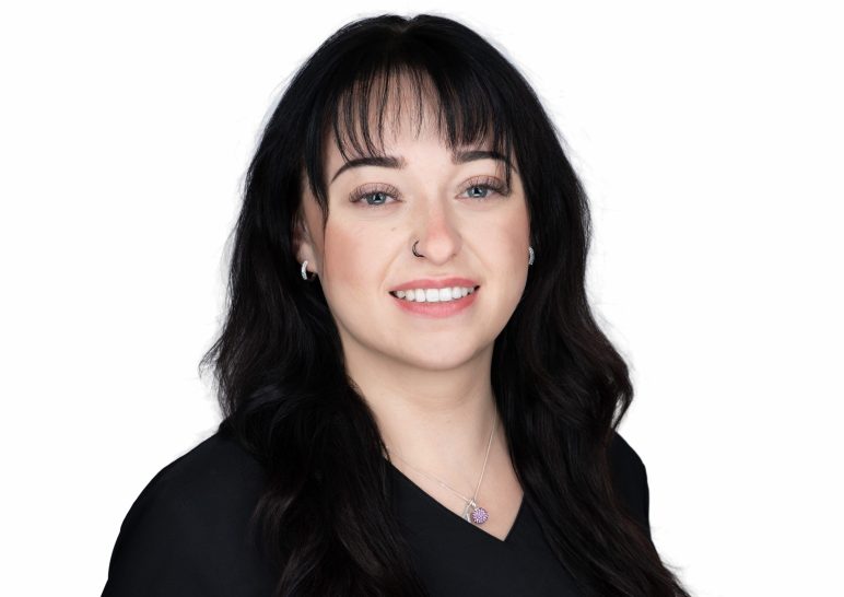 A studio portrait of a professional business headshot.