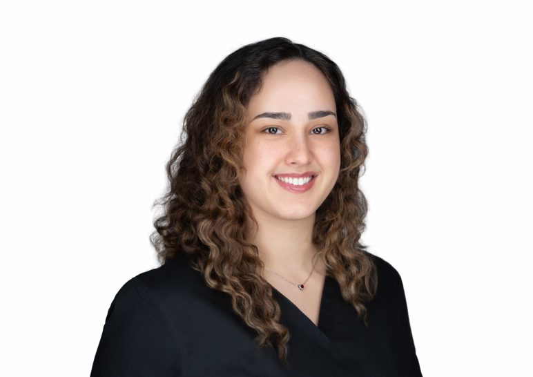 A studio portrait of a professional business headshot.