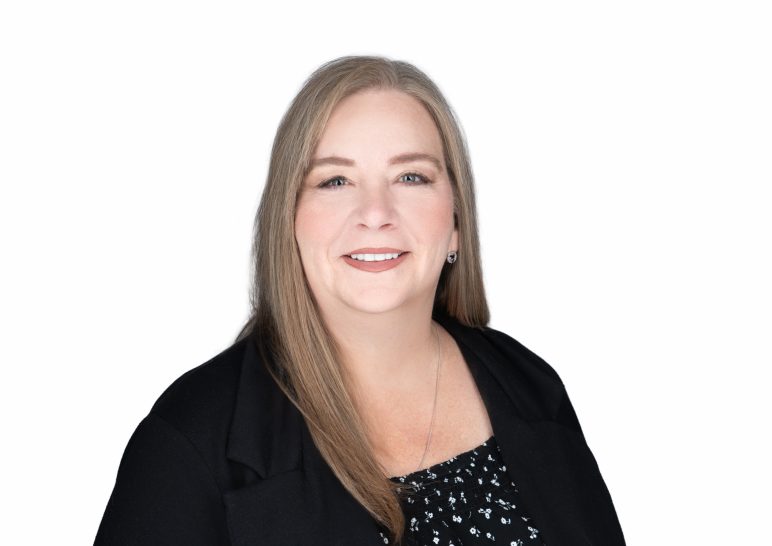 A studio portrait of a professional business headshot.